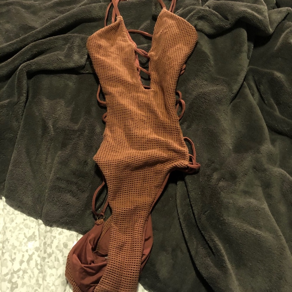 A brown one piece opened suit!